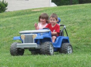3 yr olds wheeling the drainage ditch.jpg