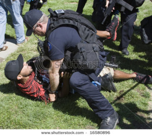 stock-photo-denver-august-a-police-officer-tackles-and-arrests-a-protester-during-the-democratic.jpg